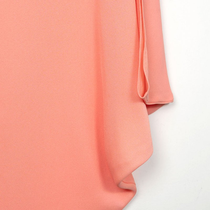 【季芹私服】MOMA 粉橘色珠鍊滾邊領口不對稱設計長版上衣-1