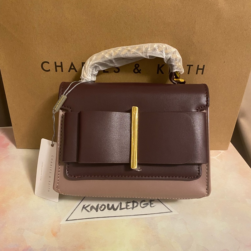 ⭐️ 全新標籤附背帶～CHARLES & KEITH 小ck 蝴蝶結金屬手提包（粉紫）可手提、側背❤️萊爾富免運費-0