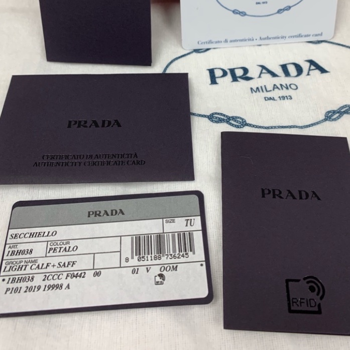 芭比粉無所不在~~Prada 經典三角金屬LOGO小牛皮兩用迷你水桶包(粉紅)-1