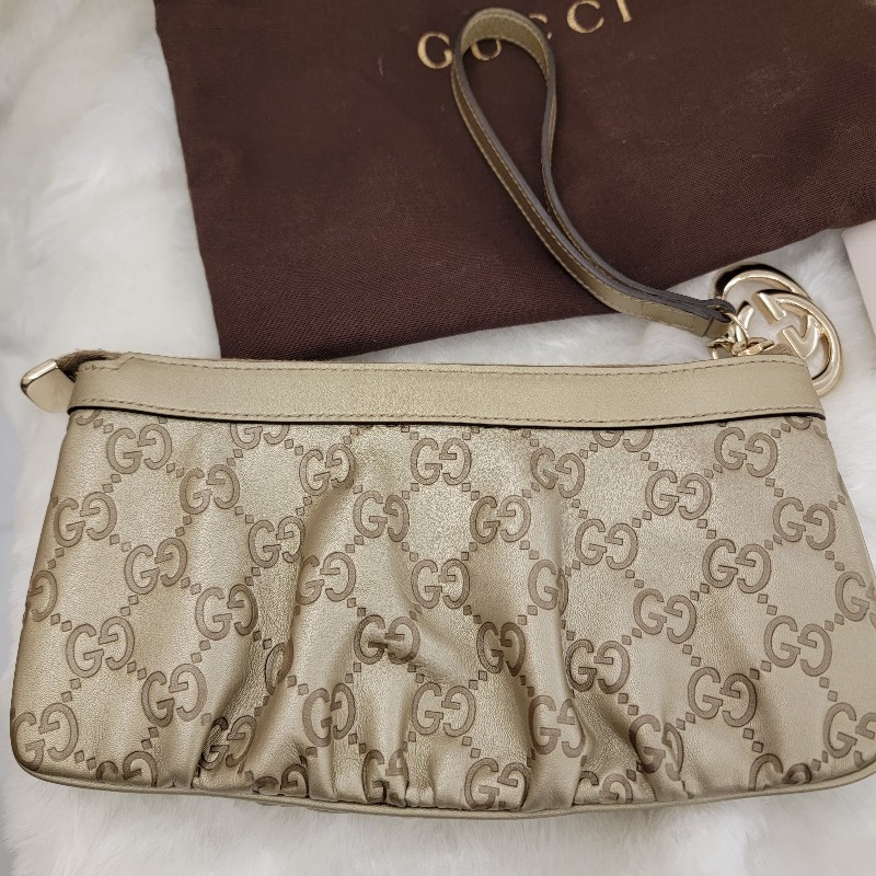 GUCCI牛皮壓紋金釦拉鍊手拿包/晚宴包-0