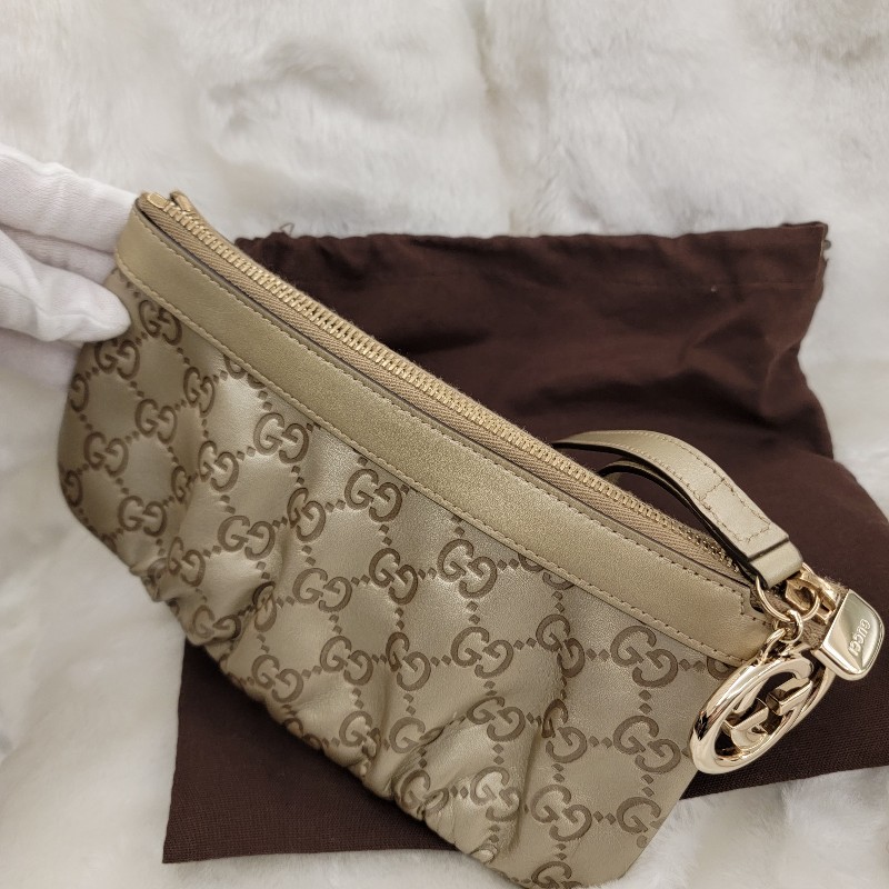 GUCCI牛皮壓紋金釦拉鍊手拿包/晚宴包-1