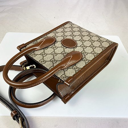 GUCCI 咖啡色 PVC INTERLOCKING G MINI琴譜包 671623-2