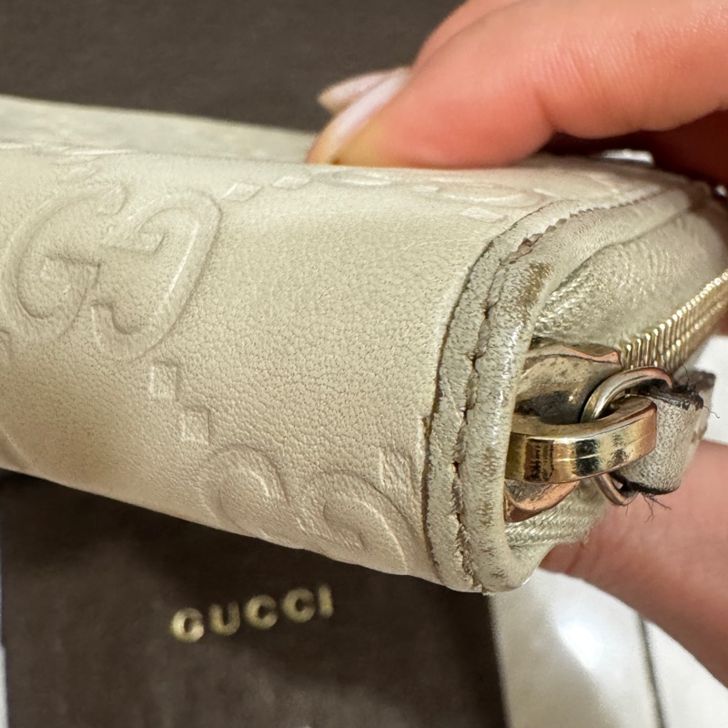 GUCCI象牙白雙G壓紋牛皮蝴蝶結拉鍊長夾-10