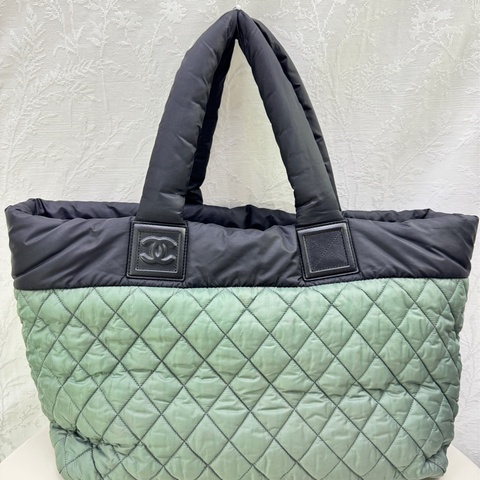 Authentic Chanel Cocoon bag in sage green with black leather trim.