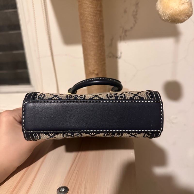 Tory Burch 經典復古藏藍老花琴譜包-2