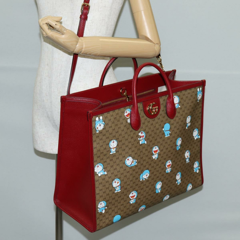 【日本直送】GUCCI 微型 GG Supreme 哆啦 A 夢手提包 PVC 兩用棕金色 653952 正品 131782A-24