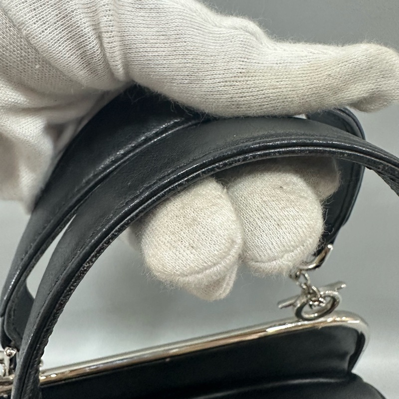 Chanel 黑皮金釦雙c手提包-55