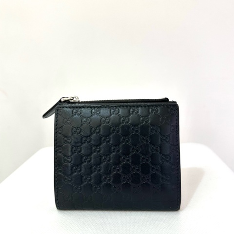 GUCCI黑牛皮小G壓紋二折短夾