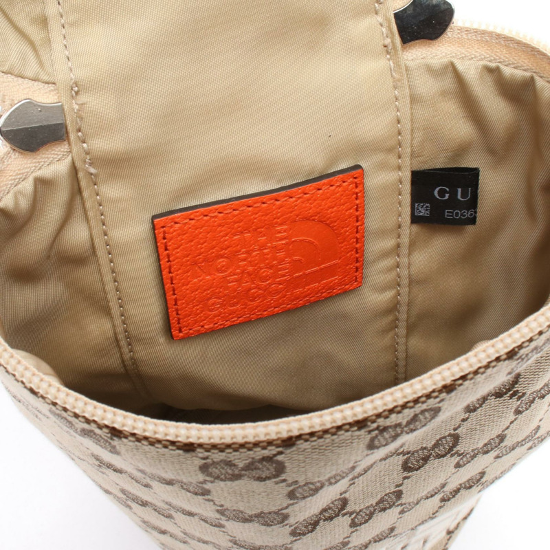 GUCCI×THE NORTH FACE GG帆布斜背肩背包 679760 公尺棕色-4