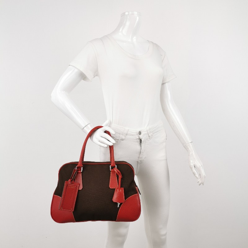 Prada牛皮帆布拼色三角徽標拉鍊手提包-1