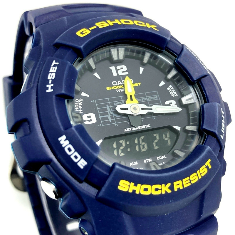 卡西歐 G-SHOCK G-100-2BM 海軍藍腕錶，附避震曲線，黃色錶盤，指針/數位雙顯，2000 年 2 月發布，Mikunigaoka 商店，IT3NKDIWG4-3