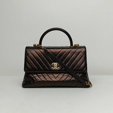 CHANEL 黑色牛皮24開金扣V紋CocoHandle中號29肩背包