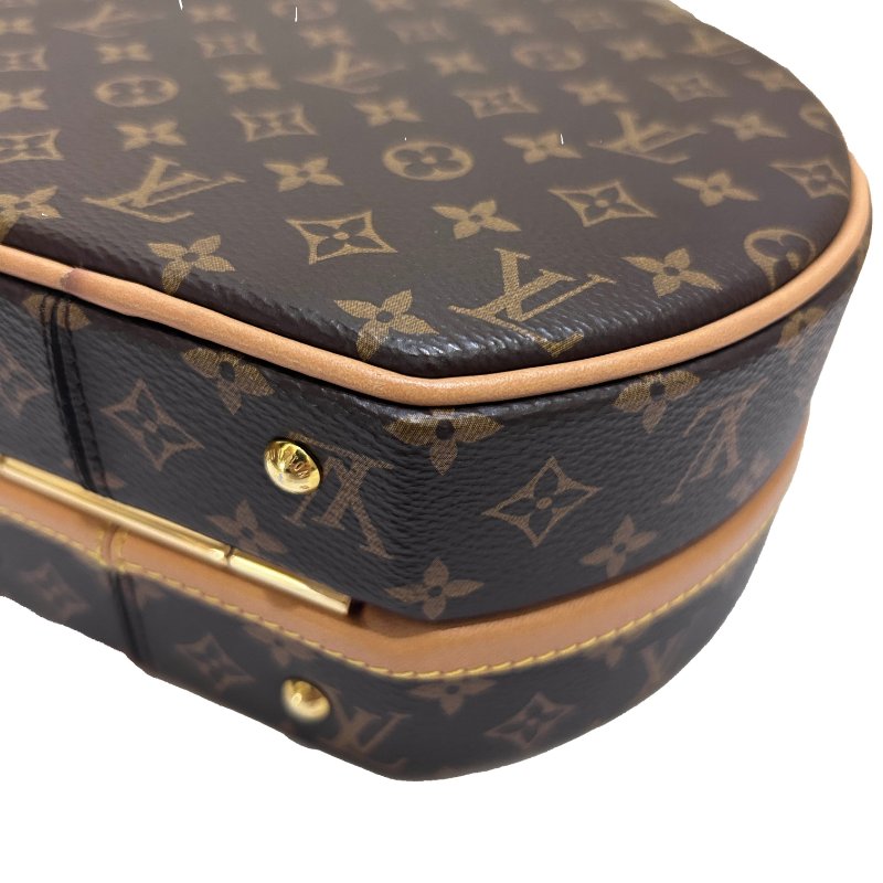 LV字紋硬殼圓餅提背二用包-2