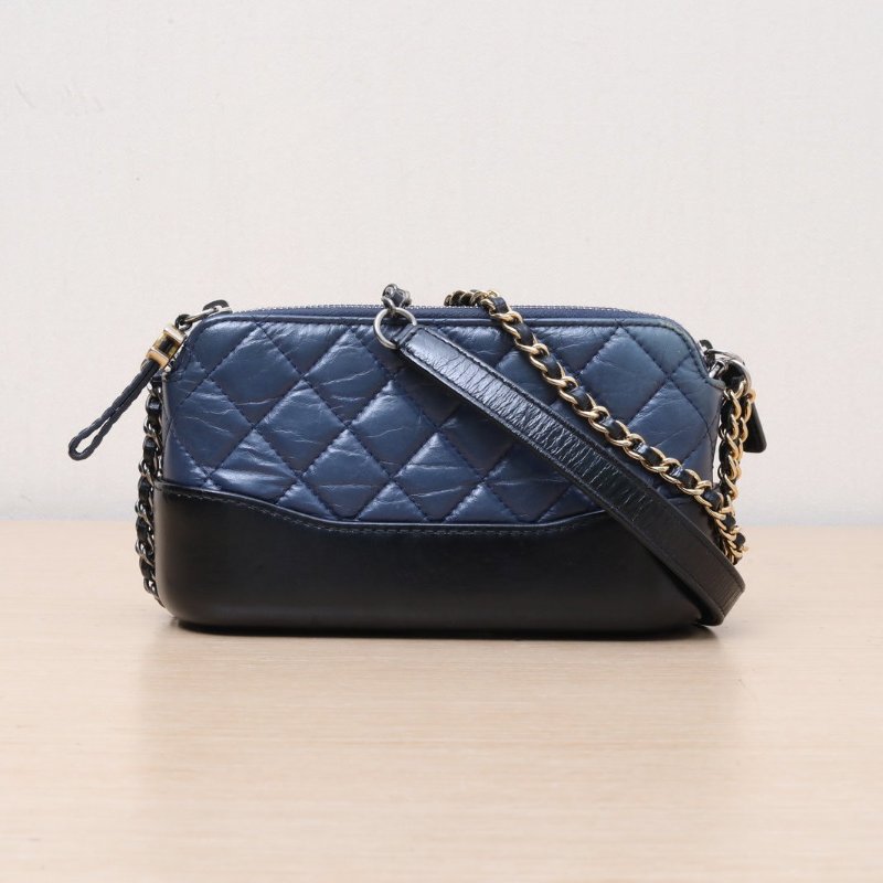 CHANEL GABRIELLE流浪WOC拉鏈版19藍色牛皮25開金銀扣肩背包-1