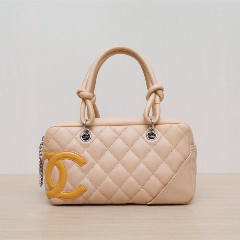 CHANEL 橘色牛皮10開銀扣中古康鵬枕頭包mini單肩包肩背包-1