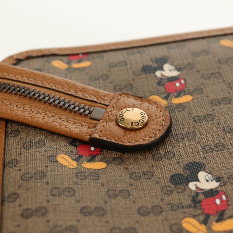 【日本直送】GUCCI GUCCIxDisney GG Supreme 手拿包 PVC 米色金色 602552 正品 152362M-7
