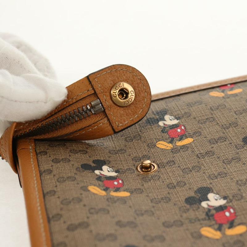 【日本直送】GUCCI GUCCIxDisney GG Supreme 手拿包 PVC 米色金色 602552 正品 152362M-8