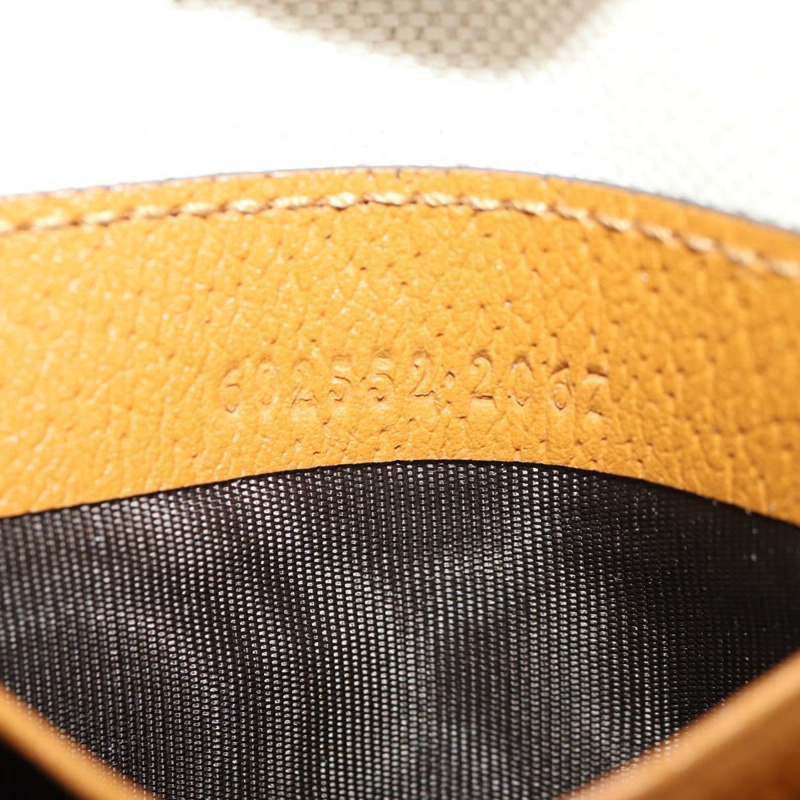 【日本直送】GUCCI GUCCIxDisney GG Supreme 手拿包 PVC 米色金色 602552 正品 152362M-11