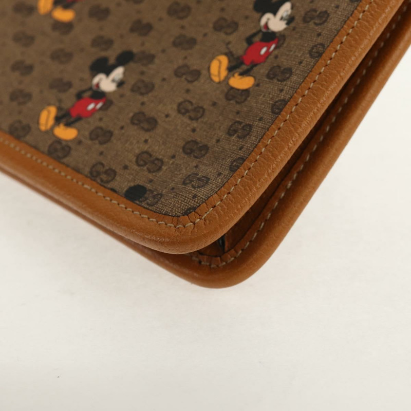 【日本直送】GUCCI GUCCIxDisney GG Supreme 手拿包 PVC 米色金色 602552 正品 152362M-13