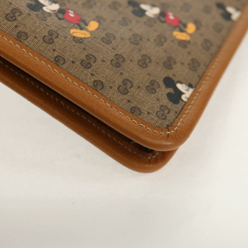 【日本直送】GUCCI GUCCIxDisney GG Supreme 手拿包 PVC 米色金色 602552 正品 152362M-14