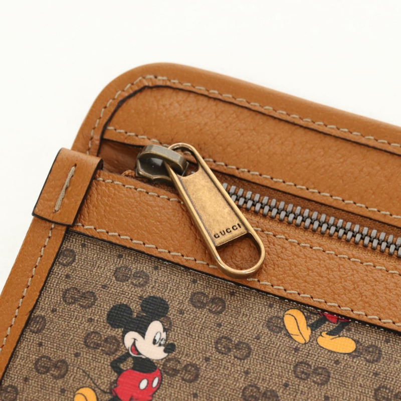 【日本直送】GUCCI GUCCIxDisney GG Supreme 手拿包 PVC 米色金色 602552 正品 152362M-17