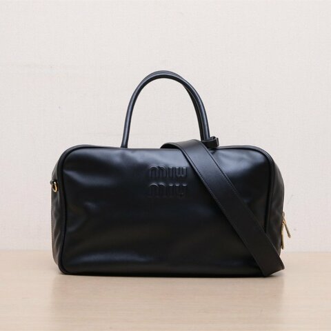 MIU MIU 保齡球公事包logo刻印徽標長手柄黑色牛皮革肩背包