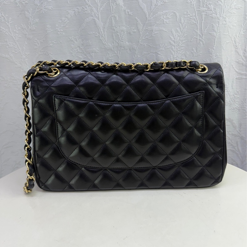This is a Chanel Classic Double Flap bag in black leather with gold-tone hardware-1