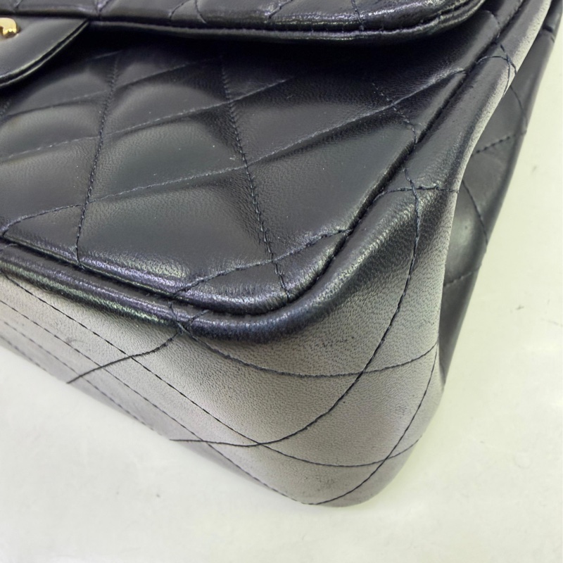 This is a Chanel Classic Double Flap bag in black leather with gold-tone hardware-3