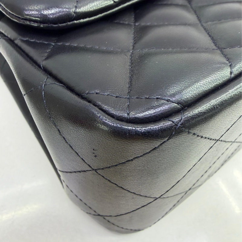 This is a Chanel Classic Double Flap bag in black leather with gold-tone hardware-8