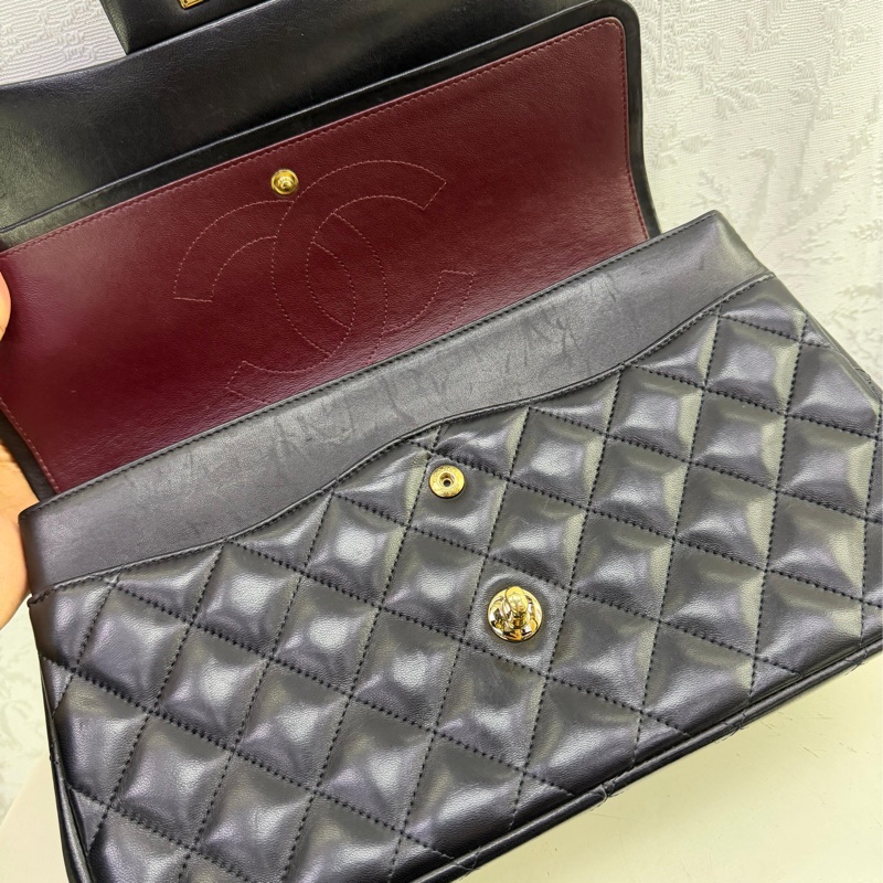 This is a Chanel Classic Double Flap bag in black leather with gold-tone hardware-9