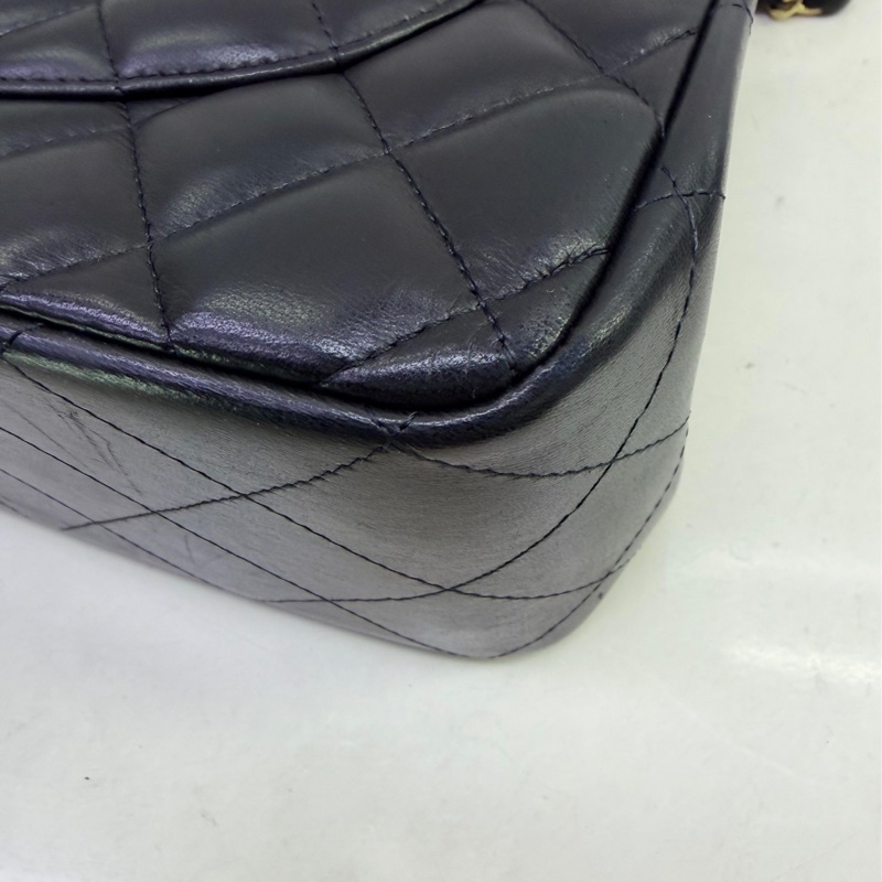 This is a Chanel Classic Double Flap bag in black leather with gold-tone hardware-12