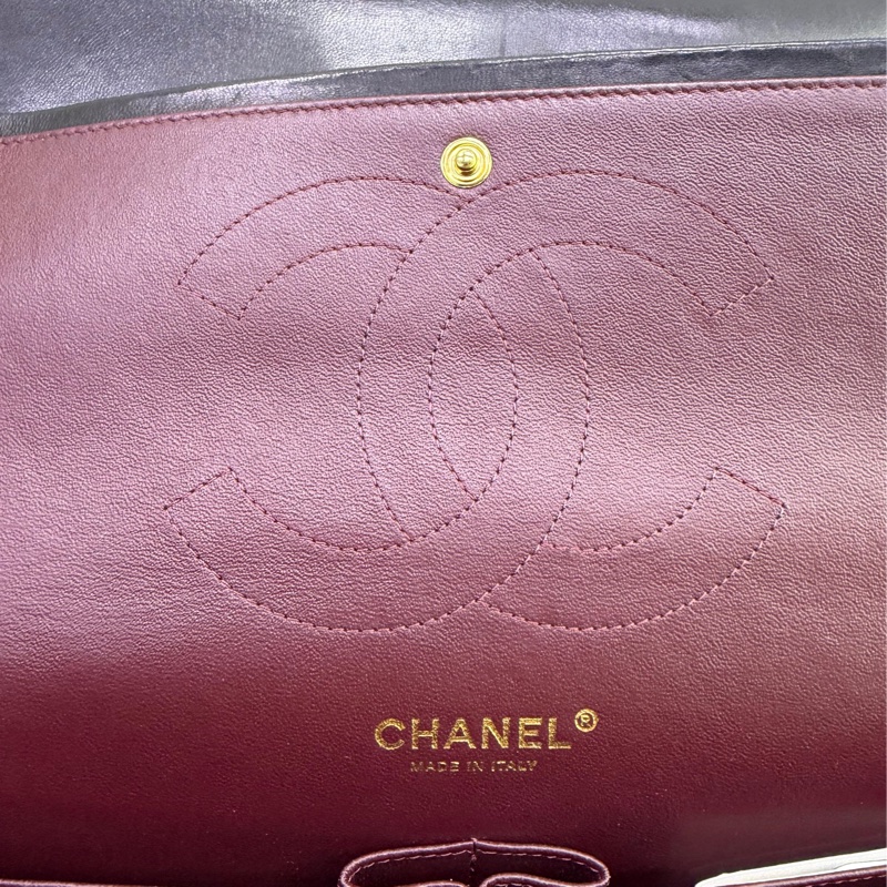 This is a Chanel Classic Double Flap bag in black leather with gold-tone hardware-15