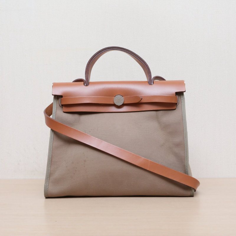 HERMES Herbag3134黃褐色帆布/Hunter牛皮A刻銀扣肩背包-1
