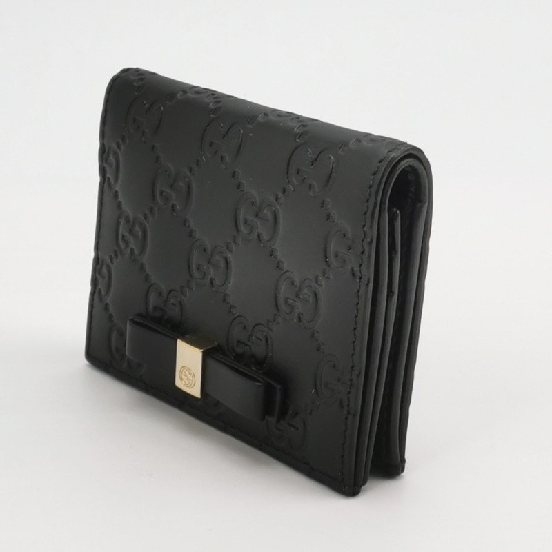Gucci牛皮純色雙G老花壓紋蝴蝶結錢包-1