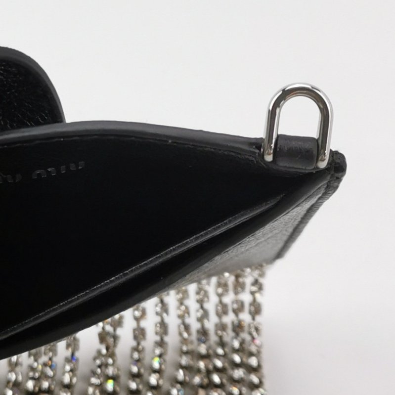 Miu Miu牛皮純色字母Logo流蘇斜挎包單肩包-6