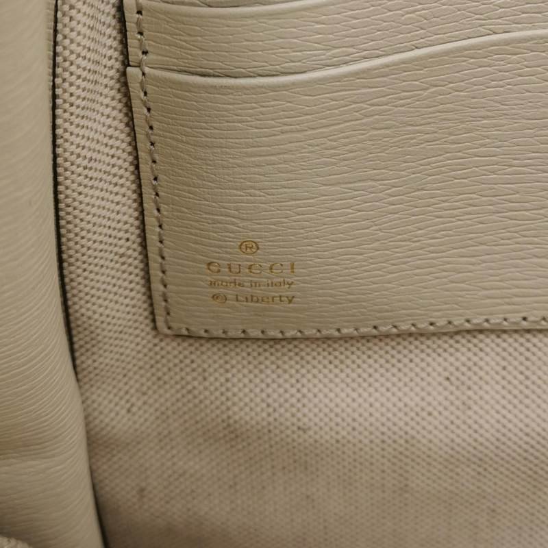 Gucci牛皮花卉滿印字母Logo拉鏈手拿包-6