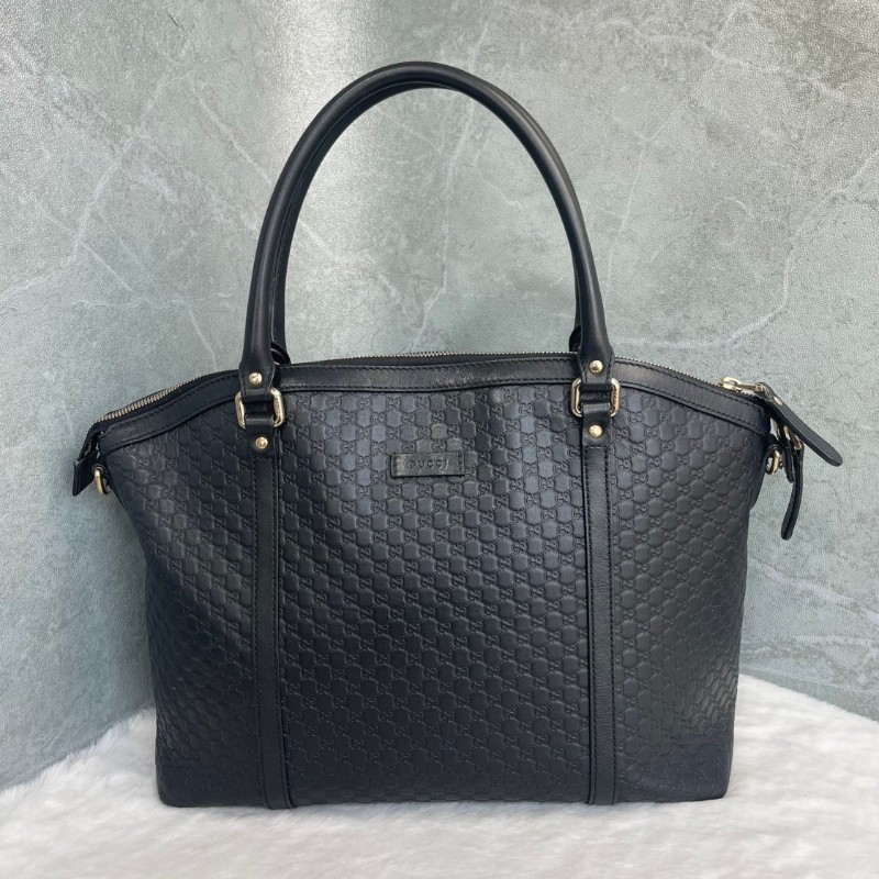 GUCCI 黑色牛皮老花壓印手提包-0