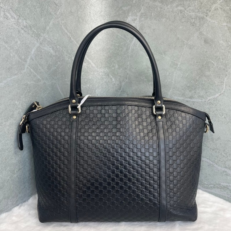 GUCCI 黑色牛皮老花壓印手提包-1