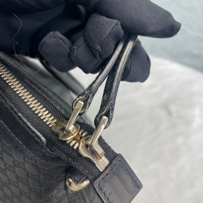 GUCCI 黑色牛皮老花壓印手提包-8