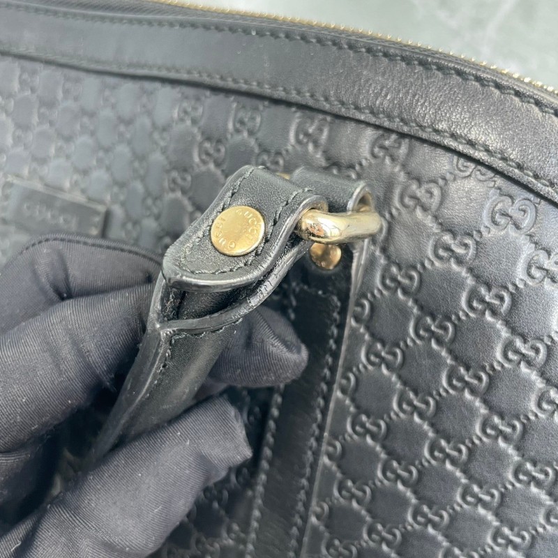 GUCCI 黑色牛皮老花壓印手提包-9