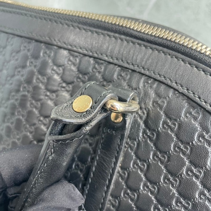 GUCCI 黑色牛皮老花壓印手提包-11
