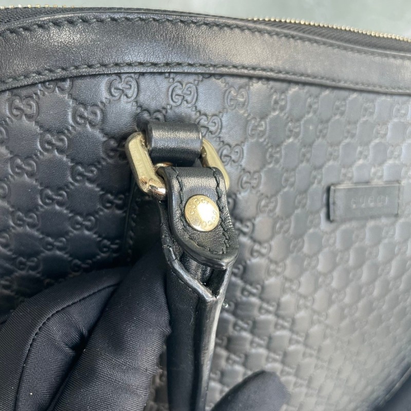 GUCCI 黑色牛皮老花壓印手提包-12