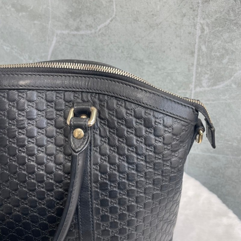 GUCCI 黑色牛皮老花壓印手提包-13