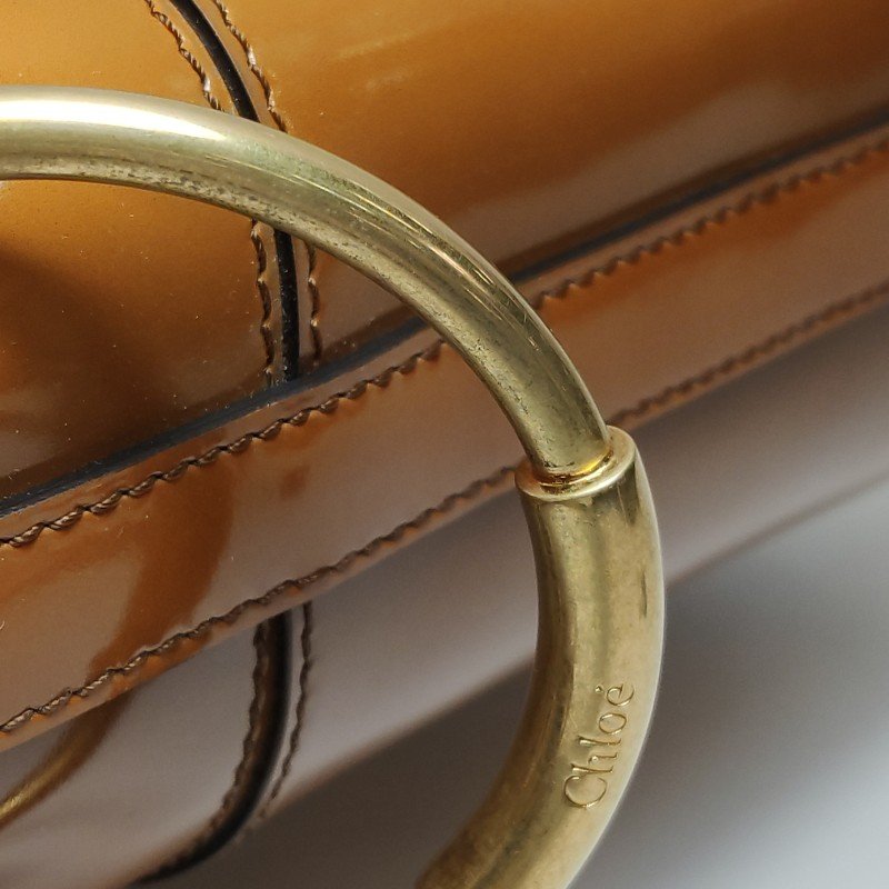 Chloe Roy牛皮帆布Logo壓紋穿孔圓環斜挎包單肩包-10