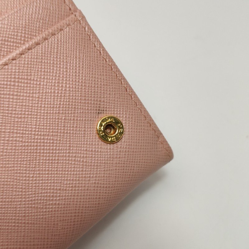 Prada牛皮純色字母Logo蝴蝶結錢包-10