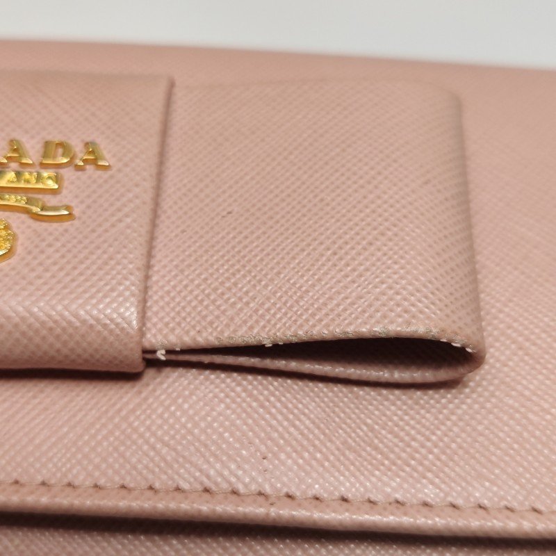 Prada牛皮純色字母Logo蝴蝶結錢包-12