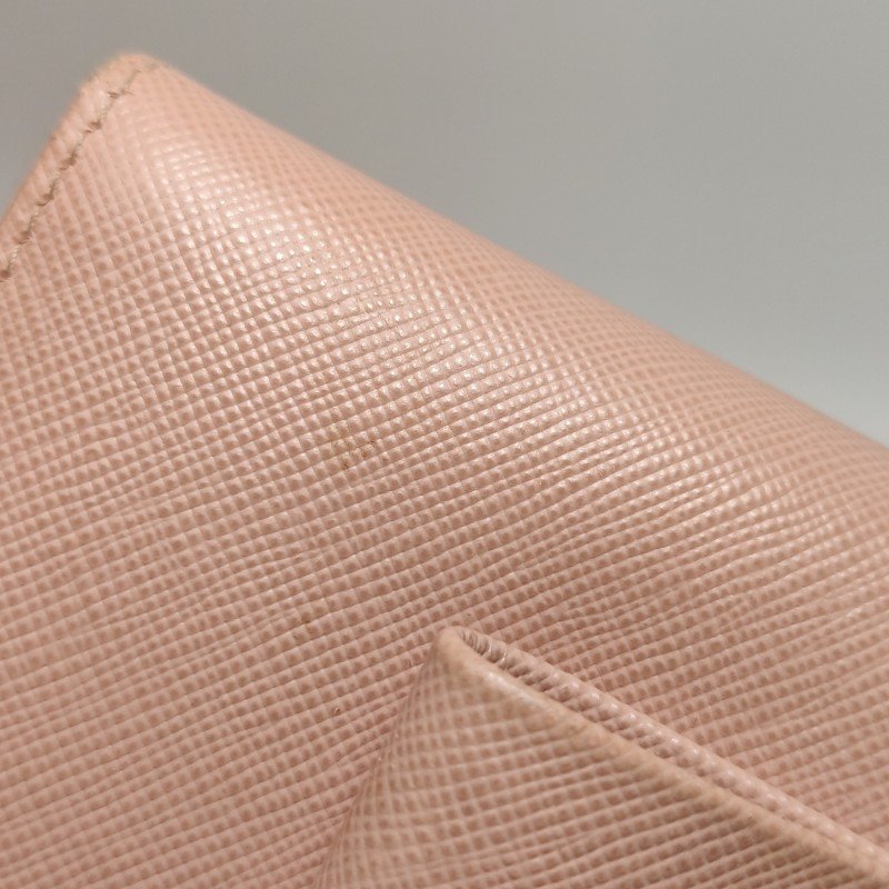 Prada牛皮純色字母Logo蝴蝶結錢包-17