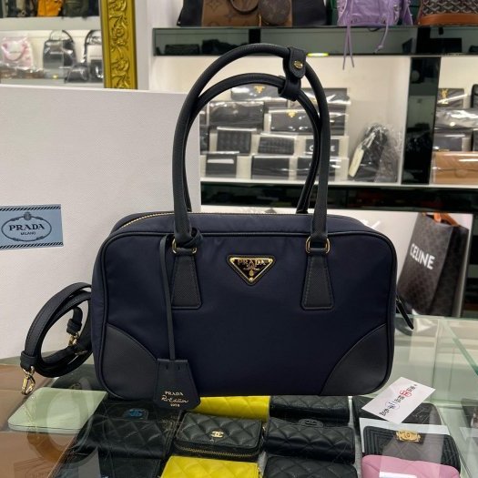 東區正精品㊣PRADA 1BB115 1978 深藍色尼龍金三角牌皮革背帶斜背包肩背包保齡球包兩用包 RZ6131-0