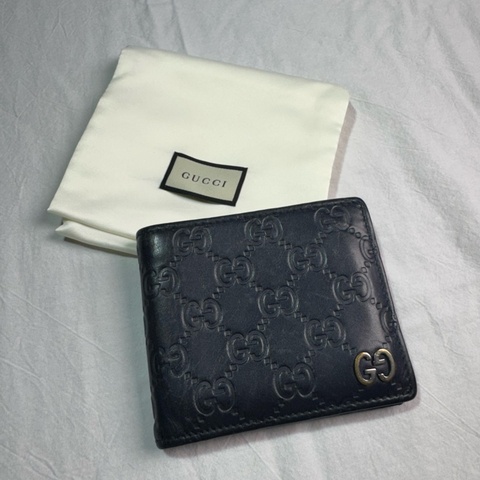 Gucci壓紋牛皮二折對開短夾