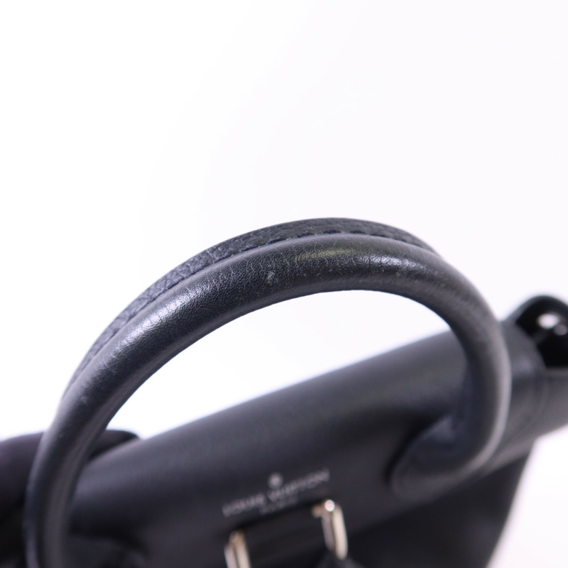 LOUIS VUITTON 牛皮皮革Lock Me Backpack銀扣背包-14